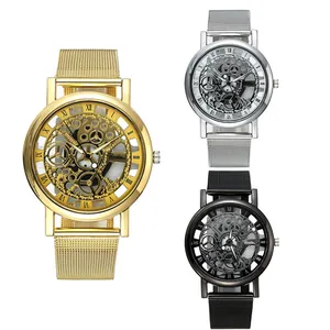 Detailed view of three skeleton dial quartz watches with mesh straps in gold silver black