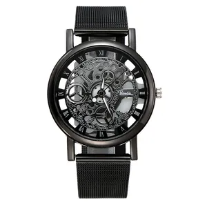 Detail view of men's quartz watch featuring a black skeleton dial and mesh steel strap