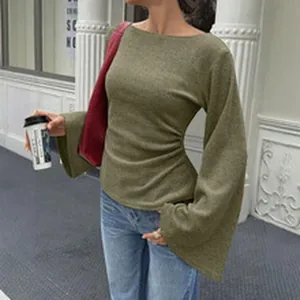 Detail view of a stylish olive green ribbed long sleeve top featuring flared bell cuffs