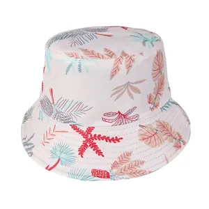 Detail of tropical leaf and starfish pattern on a white cotton sun bucket hat