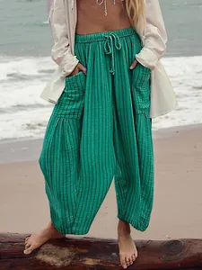 Stylish women's green cotton linen pleated casual pants perfect for summer beach vacations