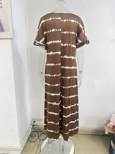 Back view detailed look at brown tie-dye striped maxi dress with ruffled short sleeves