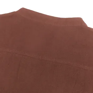 Close-up of medieval men's shirt collar with textured brown fabric