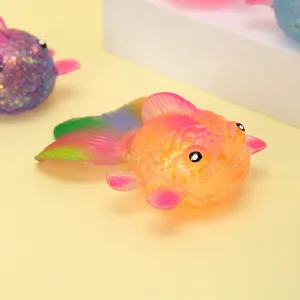 Macro detail of a colorful glittery goldfish maltose squeeze toy for stress relief