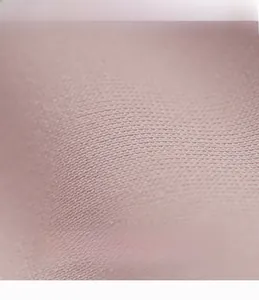 Macro view showing the breathable and soft texture of the pink yoga pants fabric