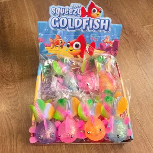Set of colorful squeezy goldfish stress relief toys in a retail display box for kids