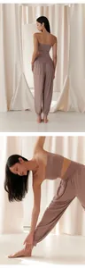 Detailed view of mauve loose yoga lantern pants and bandeau top set on Asian model