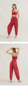 Back and side view of loose red harem yoga pants for women with ribbed ankle cuffs