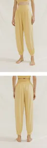 Front and back detail view of yellow loose yoga harem pants for breathable fitness