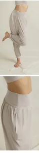 Detailed view of women's loose yoga harem pants showing soft fabric and high waist