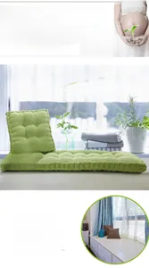 Close-up of green corduroy corn kernel texture seat cushion in a sunny bay window.