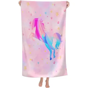 Detailed view of a colorful unicorn print on a quick-dry microfiber beach towel
