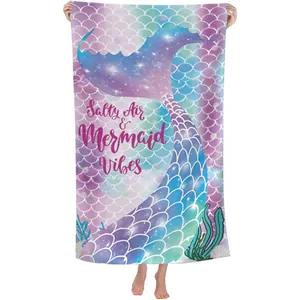 Vibrant mermaid tail microfiber beach towel with Salty Air & Mermaid Vibes text.