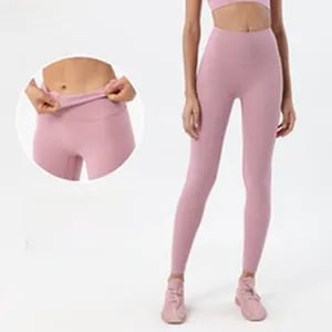 Rosa Yoga-Leggings mit hoher Taille und Anti-Roll-Bund für Fitnessübungen von Damen.