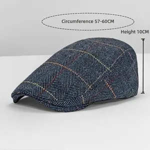 Close-up view of plaid retro beret cap with measurements for circumference and depth