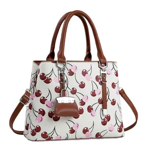 Élégant sac à main blanc pour femme avec motif de cerises et mini charme de sac