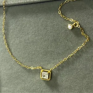 Elegant S925 sterling silver necklace with square cubic zirconia pendant in gold finish.