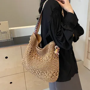 Bohemian large capacity straw tote bag with colorful wide shoulder strap for beach.