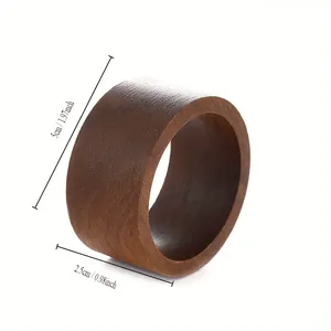 Detailed view of a minimalist wooden napkin ring showing 5cm and 2.5cm dimensions