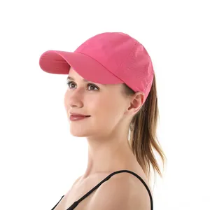 Side view detail of a pink breathable quick-dry ponytail sports baseball cap with mesh