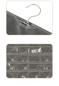 Detailed view of the durable stainless steel hook and transparent PVC jewelry storage pockets.