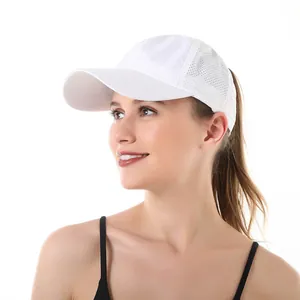 Side view of a white breathable mesh sports baseball cap worn by a female model.