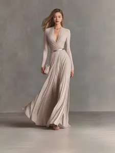 Elegant beige long-sleeve maxi dress with pleated waist and deep V-neck detail view.