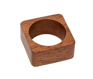 Macro detail of the natural wood grain and texture on a square wooden napkin ring.