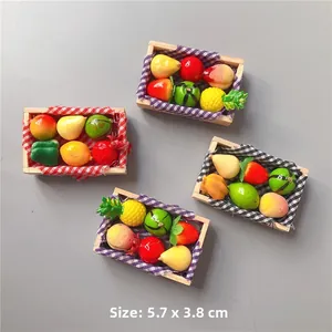 Close-up detail of miniature fruit basket fridge magnets with assorted colorful fruits