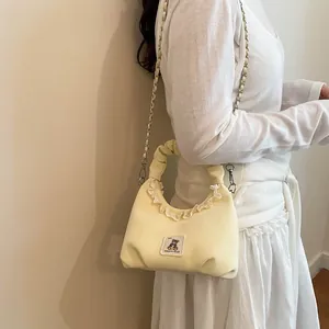 Cute cream ruched hobo bag with lace trim and bear patch, stylish crossbody bag