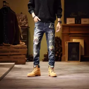 Vintage distressed slim-fit straight-leg men's jeans with patchwork detail