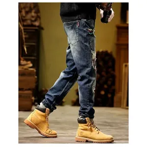 Men's vintage distressed slim-fit denim jeans with stylish patchwork and ripped detailing