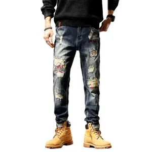 Men's slim fit retro ripped jeans with American style patches and embroidery details