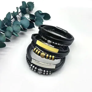 Detail view of multi-layered men's braided leather bracelets with magnetic steel clasp.