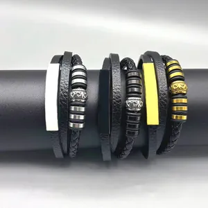 Detailed view of men's retro multi-layer braided leather bracelets with steel charms