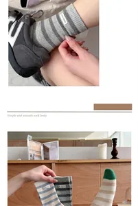 Close-up detail of stylish striped combed cotton socks for women in soft tones