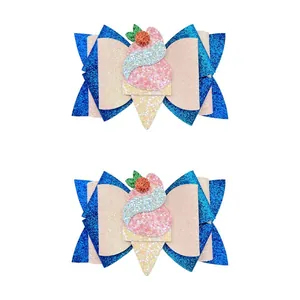 Detail view of two glitter ice cream cone hair clips for girls on white background
