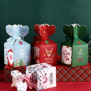 Detailed view of colorful Christmas gift boxes with festive patterns and ribbon bows.