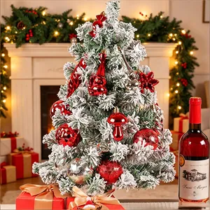 Frosted mini Christmas tree with 28pcs red and silver ornaments for festive table decor.
