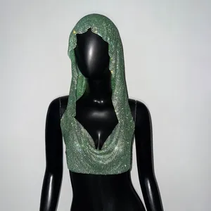 Detailed view of a sparkling green rhinestone hooded crop top on a black mannequin display.