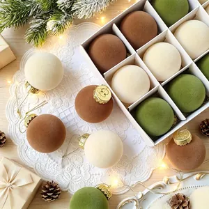 Elegant velvet flocked Christmas ball ornaments set in earthy tones for tree decor.