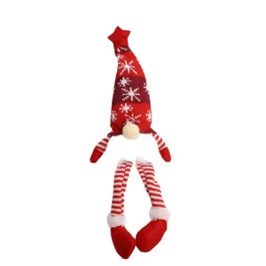 Festive knitted Christmas gnome hanging ornament with snowflake hat and red striped legs