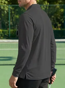 Close-up of a dark grey long sleeve polo shirt showing the textured sports fabric