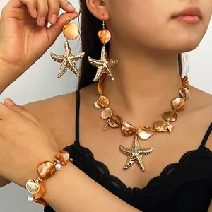Set di gioielli bohémien con conchiglie e stelle marine dorate per donna e ragazza