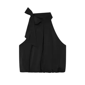 Elegant black halter neck top featuring a large bow detail and smooth satin-like finish.