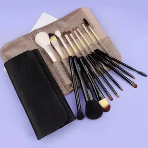 9-piece makeup brush set with soft pony hair and black travel pouch on purple background
