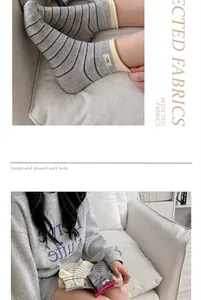 Detailed macro view of soft striped combed cotton crew socks in a cozy home setting
