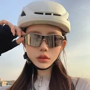 Trendy outdoor sports windproof cycling sunglasses shown on a model during sunset