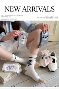 Lifestyle view of cute cartoon dog mid-tube cotton socks in Japanese preppy style.