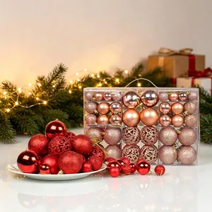 Festive Christmas ball ornament set featuring red and rose gold spheres in a gift box